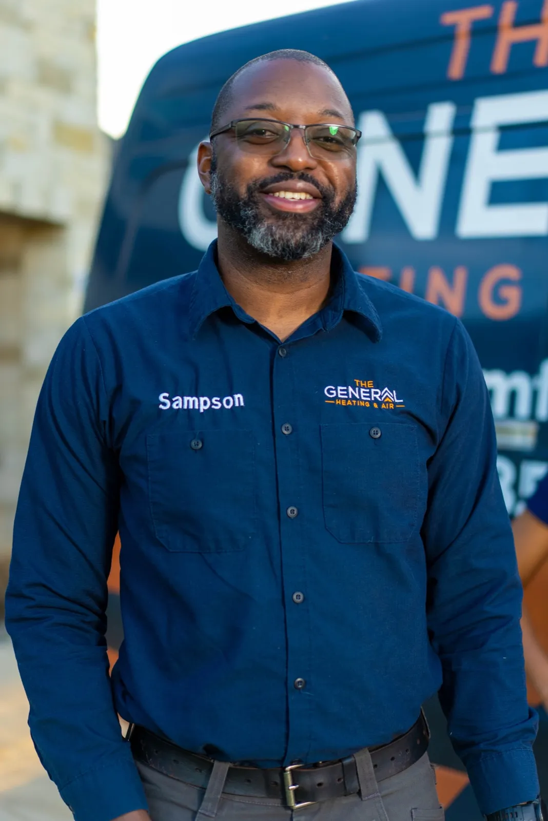 Adé Sampson, co-founder and licensed HVAC contractor, in front of The General service van