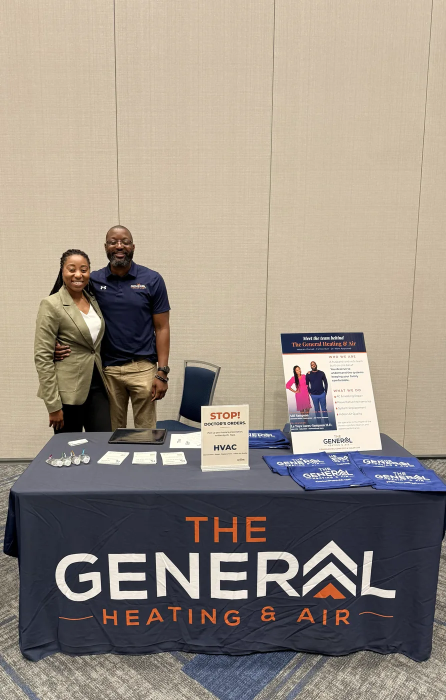 Adé Sampson and La Toya Luces-Sampson, MD at The General Heating & Air's booth at a community event in Cypress